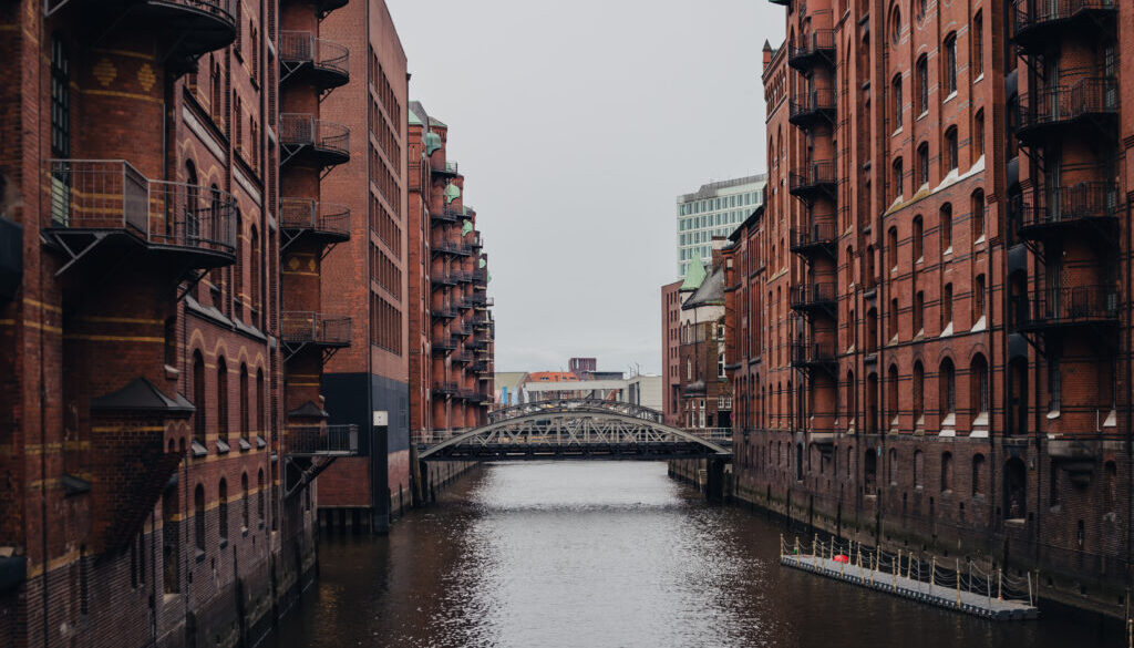 Warehouse district of Hamburg, bridge among architecture, cityscape.